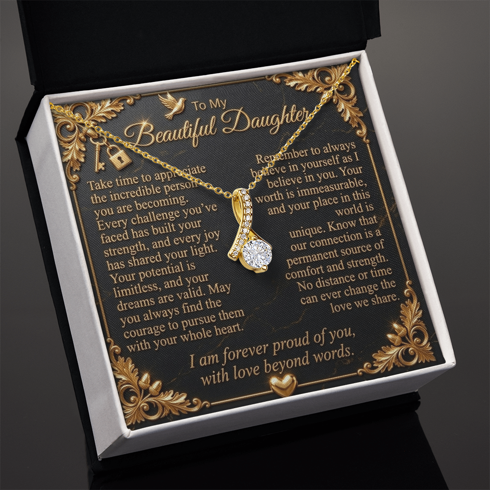 Angled view of a yellow gold-finish necklace and daughter message card in an open standard gift box.