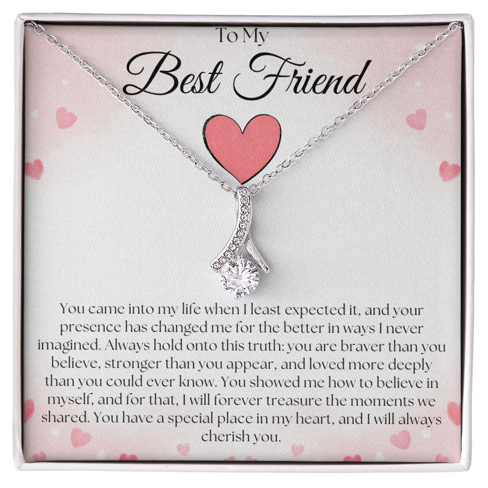 Silver-tone curved pendant necklace with a round clear stone on a pink-heart To My Best Friend card in a white gift box.