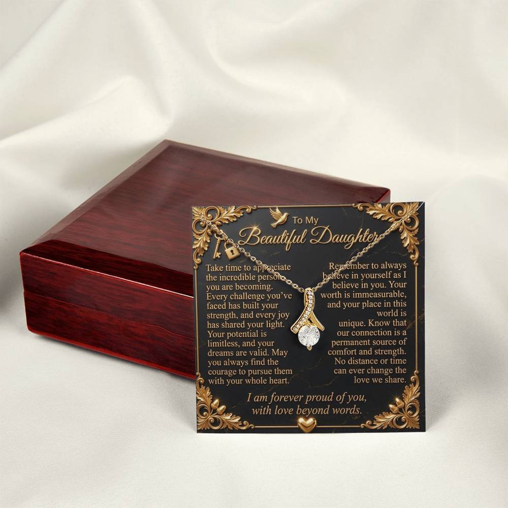 Yellow gold-finish necklace on a daughter message card beside a closed mahogany-style gift box