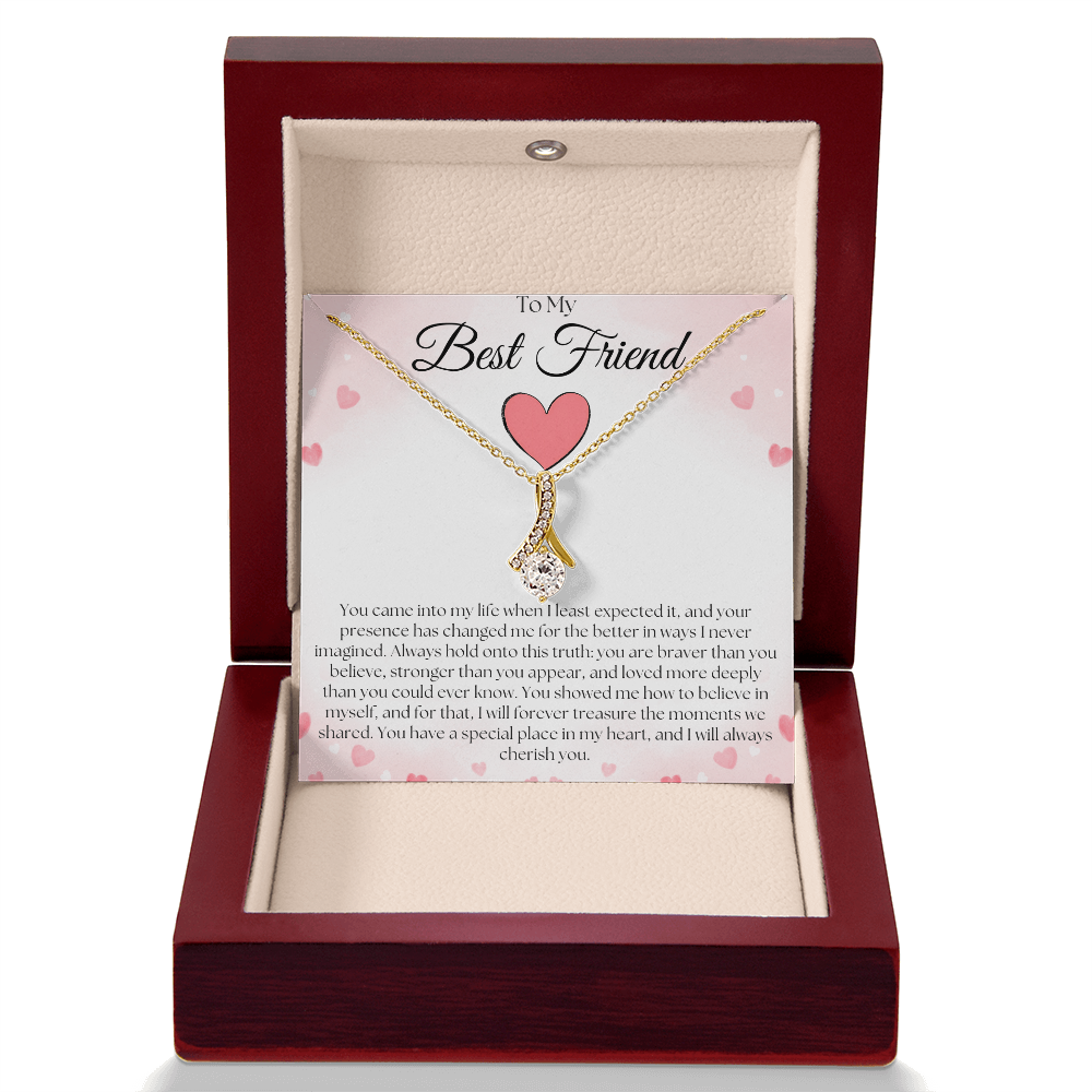 Gold-tone pendant necklace and best-friend card displayed upright in a reddish-brown gift box against white.