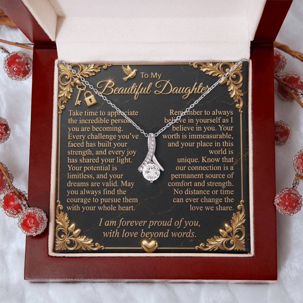 White gold-finish necklace and daughter message card in a luxury gift box surrounded by decorative red berries.