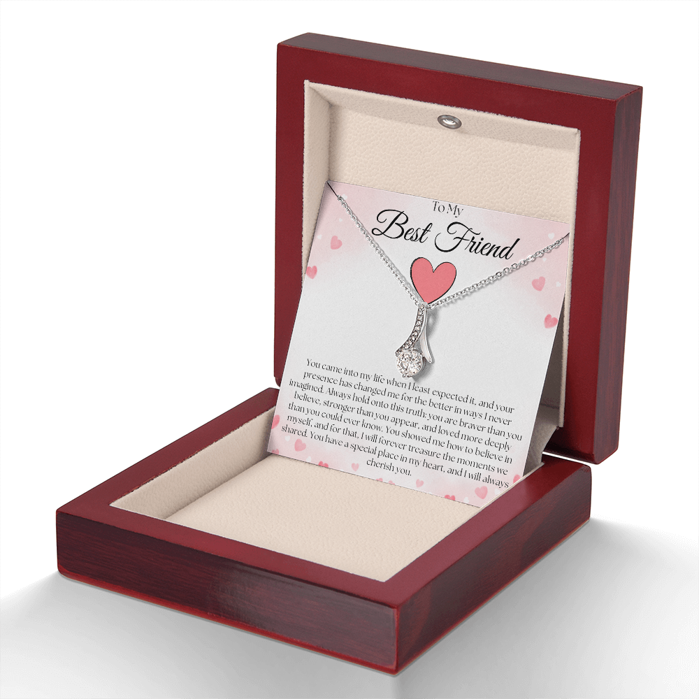 Silver-tone pendant necklace and best-friend card displayed upright in a reddish-brown gift box against white.