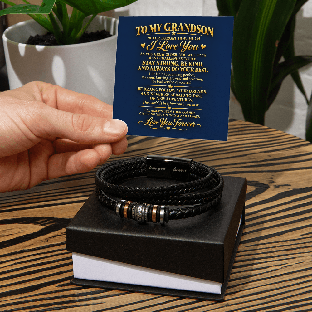  Black braided bracelet on a two-tone gift box, with a hand holding a blue “To My Grandson” message card