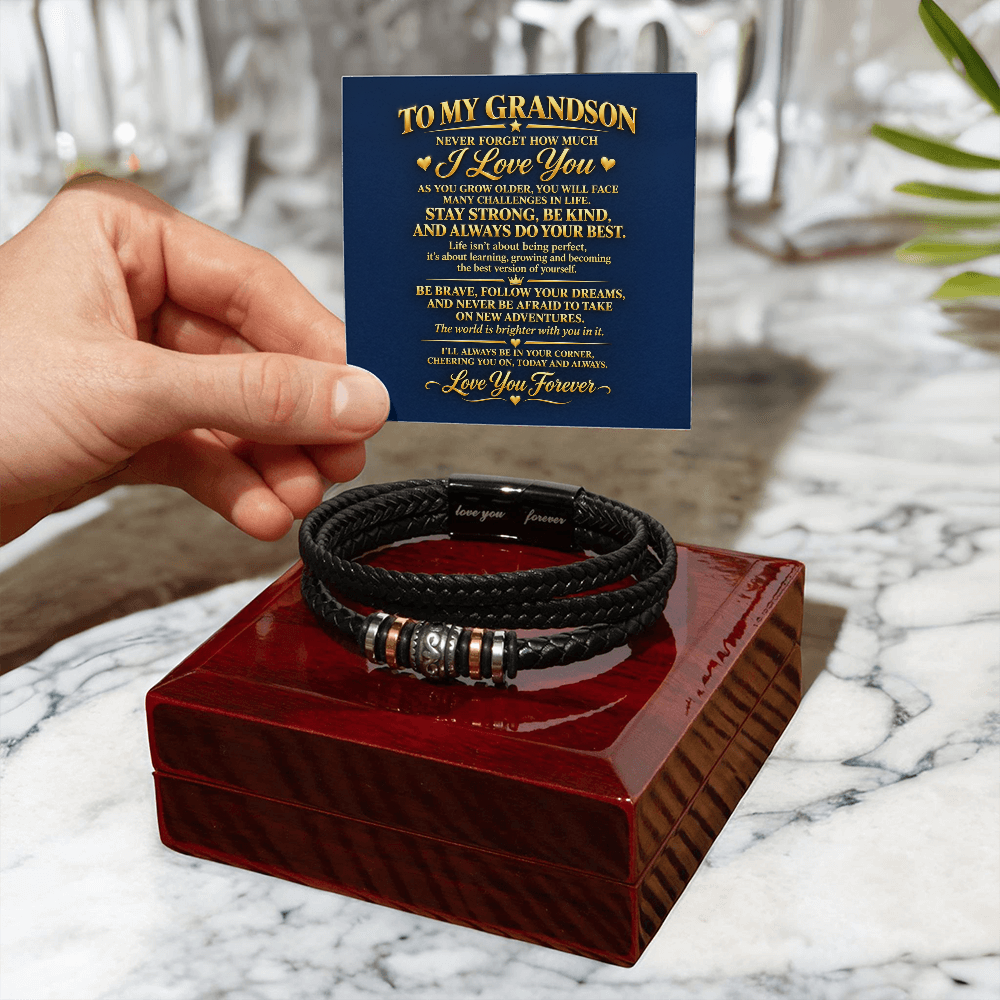  Black braided bracelet on a closed mahogany-style gift box, with a “To My Grandson” card held above it.